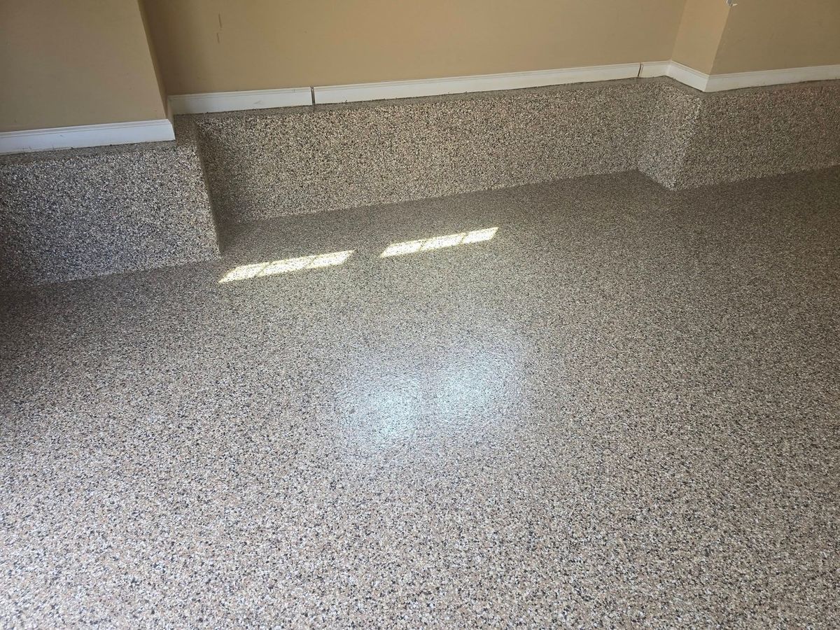Two-bay garage with a fresh gray flake epoxy floor