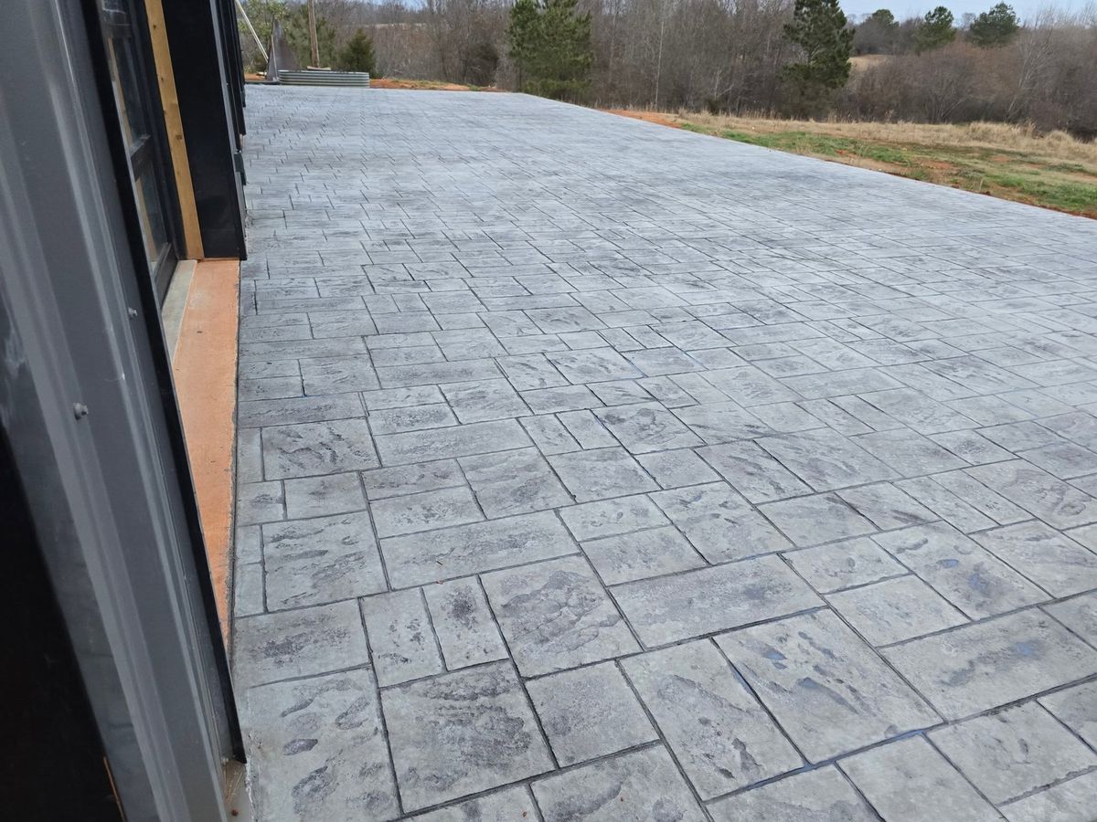 Stamped patio in a slate pattern looking out over the woods