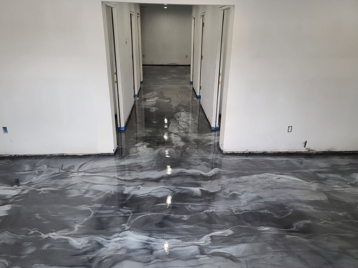 Metallic epoxy hallway floor reflecting the doorway light