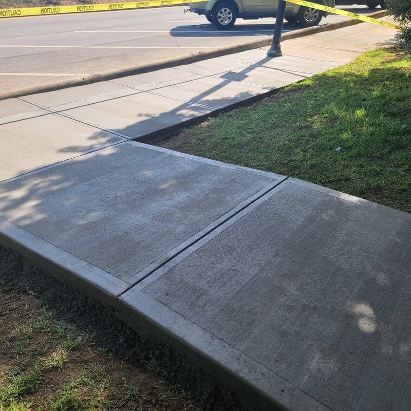 New concrete driveway apron and sidewalk at the street
