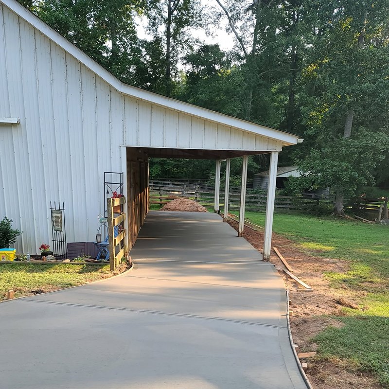 Pole-barn carport with a new concrete slab underneath