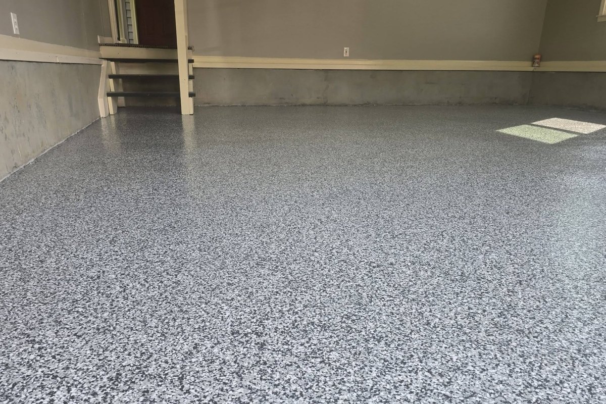 Flake epoxy garage floor in the corner by the water heater