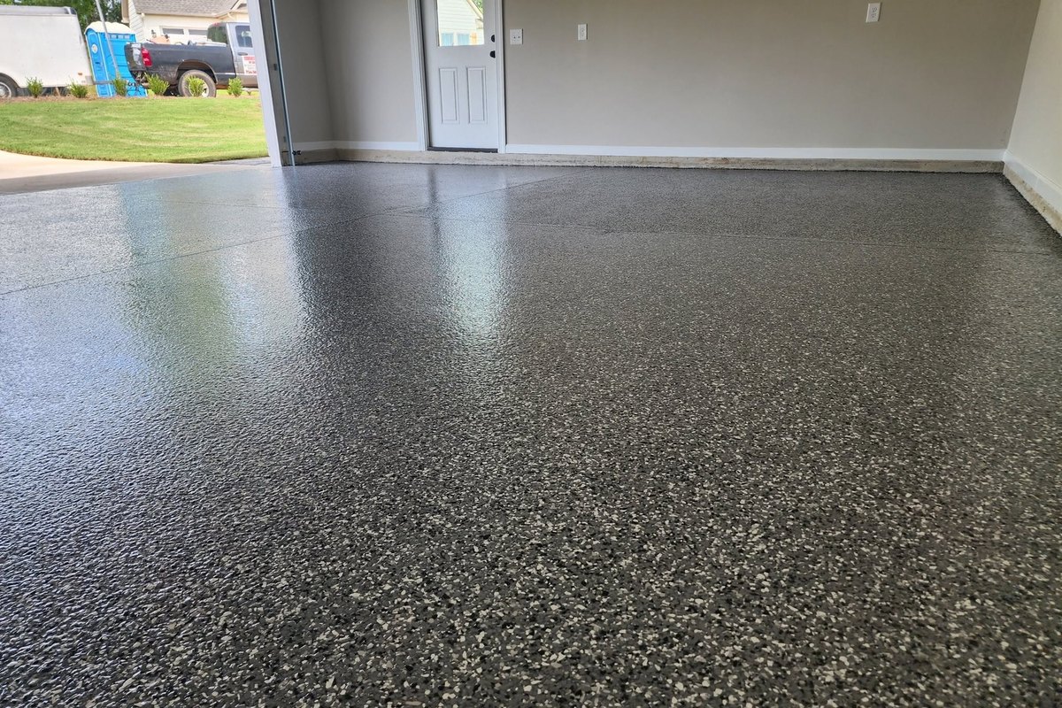 Gray flake epoxy garage floor beside the side entry door