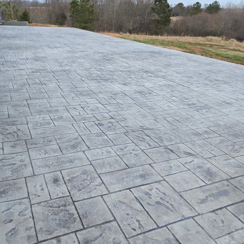 Slate-pattern stamped patio looking out over the woods